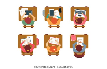 Students with books, laptops and digital tablets sitting behind desks, top view. Teenagers at classroom. Flat vector design
