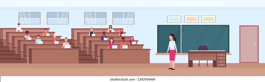 Students Sitting At Desks And Listening Teacher In Auditorium Lecture Hall Theater Room Interior Modern University Classroom With Rows Of Seats And Chalk Board Flat Horizontal Banner