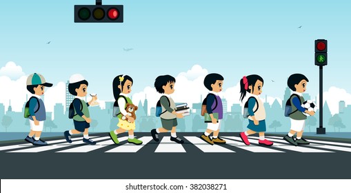 Students Walk Across The Crosswalk With A Traffic Light.