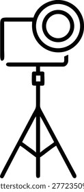 Studio light on tripod for photography and film production.