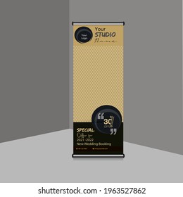 Studio roll up banner. Discount roll-up banner for studio promotions. EPS vector design back and gold color roll-up banner.