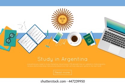 Study in Argentina concept for your web banner or print materials. Top view of a laptop, books and coffee cup on national flag. Flat style study abroad website header.