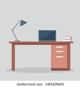 Study desk with lamp and laptop