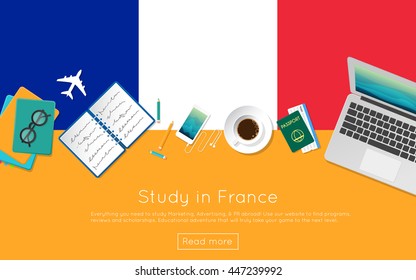 Study in France concept for your web banner or print materials. Top view of a laptop, books and coffee cup on national flag. Flat style study abroad website header.