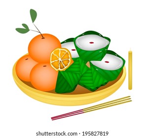 Stuffed Dough Pyramid Dessert and Chinese Pudding or Chinese Sweetmeat with Sweet Orange for Pay Respect to God in Chinese New Year. 