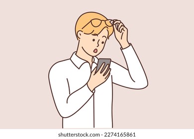 Stunned man take off glasses look at cellphone screen feeling astonished. Shocked guy surprised with message on smartphone. Vector illustration. 