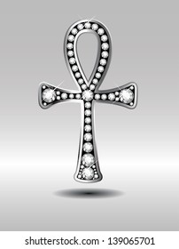 Stunning Egyptian Ankh symbol with diamond precious stones embedded into a silver channel setting. Birthstone for April. EPS-10 Vector.