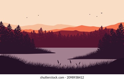 Stunning mountain view with dry tree sunrise from the lakeside at dusk in the afternoon
