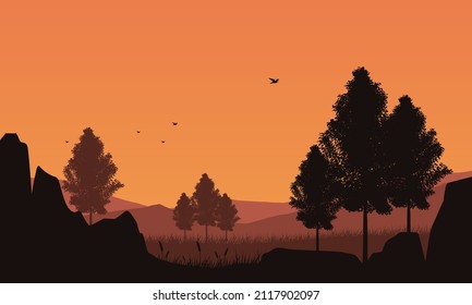Stunning mountain view in the evening from the out of the village with aesthetically dry silhouettes of trees