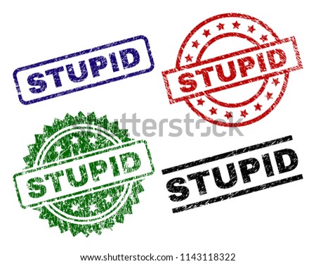 STUPID seal stamps with damaged surface. Black, green,red,blue vector rubber prints of STUPID label with grunge surface. Rubber seals with round, rectangle, medallion shapes.