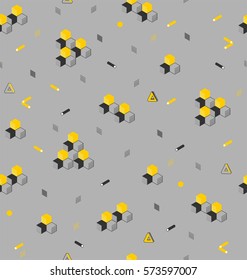 Style geometric ornament from cubic and hexagonal cylinders, in yellow and black colors a seamless pattern on a gray background.