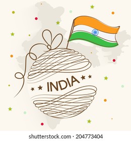 Stylish ball wrapped with ribbon and text and national flag on republic map of India background for Indian Independence Day celebrations.