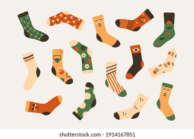 Stylish doodle socks in trendy colors with cartoon prints. A set of knitted stockings with cute design. Vector art