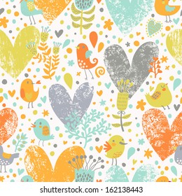 Diseño floral sin fisuras con aves en vectores. Dibujo de fondo natural en colores brillantes. Concepto romántico patrón sin fisuras con muchos corazones coloridos