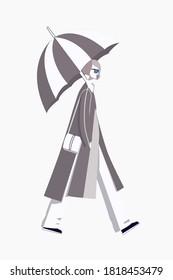 Stylish girl goes with an umbrella on a white background. Girl in autumn clothes with an umbrella.
