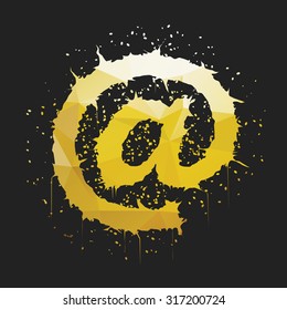 Stylish golden yellow grunge commercial at sign shaped ink splatter isolated on dark background. Arobase, asperand, ampersat, apetail symbol for your design.