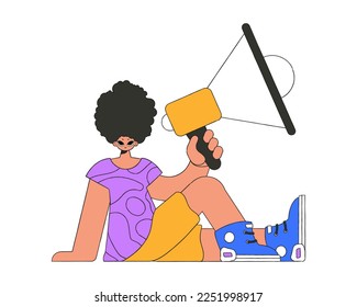 A stylish guy sits on the floor and holds a megaphone in his hand.