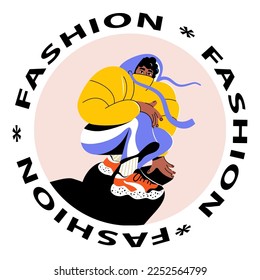 The stylish guy is squatting. Modern street fashion. Sports sneakers on a young man
