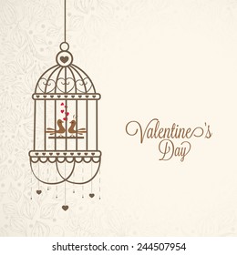 Stylish hanging cage with cute birds in love on floral decorated background for Happy Valentines Day celebration.