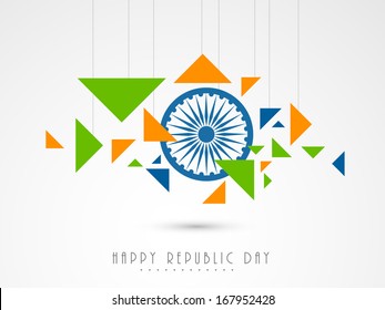 Stylish Happy Indian Republic Day concept with ashoka wheel and hanging national tricolours triangles on grey background. 