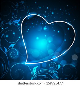 Stylish heart on shiny floral decorated blue background. 