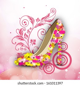 Stylish ladies shoe on floral decorative background. 