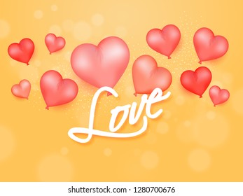 Stylish lettering of love on yellow bokeh background decorated with heart shape balloons. Valentine's Day poster or greeting card design.