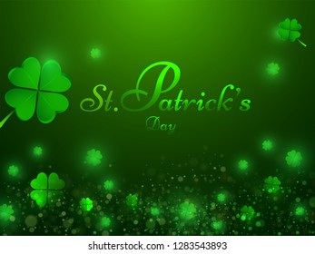 Stylish lettering of St. Patrick's Day on shamrock leaves decorated green background. Poster or banner design.