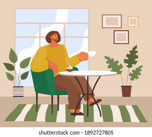 Stylish man sitting in modern armchair at home at a cozy table drinking coffee vector illustration. Male character having lunch drinking tea and eating cupcake in a cafe or restaurant, coffee break