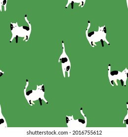 Stylish minimalistic pattern with black and white cats on green background . Cute modern Scandinavian print.