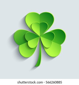 Stylish modern St. Patrick's day card with green 3d leaf clover cutting paper. Stylized shamrock isolated on grey background. Beautiful trendy wallpaper. Vector illustration 