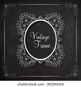 Stylish ovel shape vintage frame decorated by floral design on blackboard background.