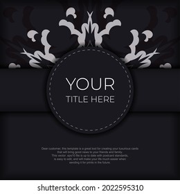 Stylish Postcard template in black color with Indian patterns. Print-ready invitation design with mandala ornament.