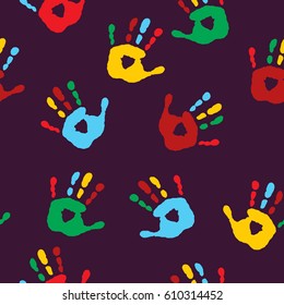 Stylish seamless pattern with a imprints of children's palms