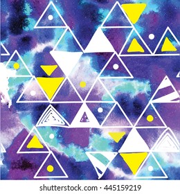Stylish seamless pattern with triangles on the background of watercolor paint stains . Bright , summer pattern .