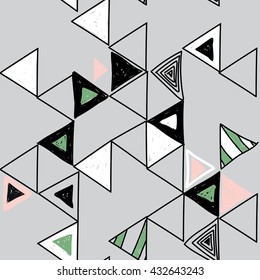 Stylish seamless pattern with triangles in a Scandinavian style . Vector freehand drawing .