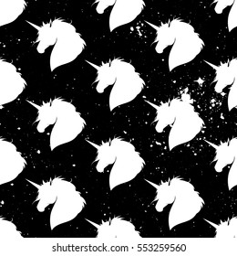 Stylish seamless texture with silhouettes of unicorns. Repeated pattern. White unicorns on a black background. It can be used as wallpaper, upholstery, wrapping, fabric or your design.