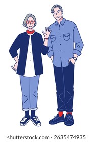 Stylish senior couple standing side by side