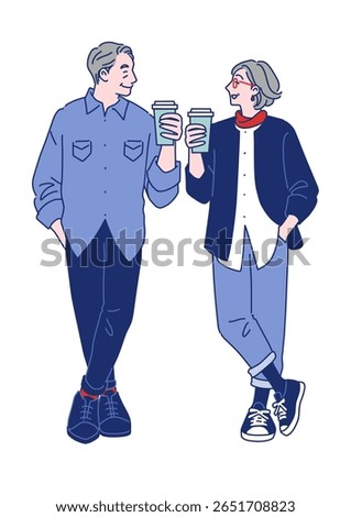 Stylish senior couple standing side by side