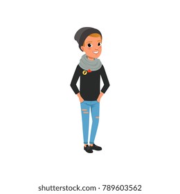 Stylish teen boy dressed in black sweater, hat, blue ripped jeans and scarf. Cartoon kid character in trendy clothes posing with hands in pockets. Flat vector design