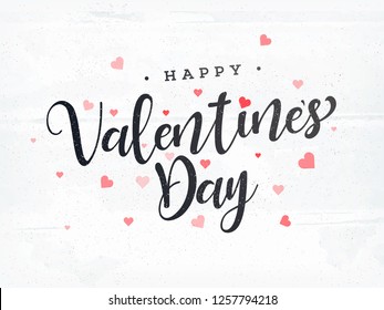 Stylish text Happy Valentines Day with heart shapes on white background.