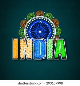 Stylish text India in national flag colors with beautiful floral design decorated Ashoka Wheel for Indian Independence Day celebration.