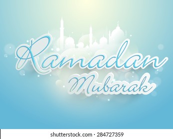 Stylish text Ramadan Mubarak on shiny sky blue background, can be used as greeting or invitation card design for Muslim community festival celebration.