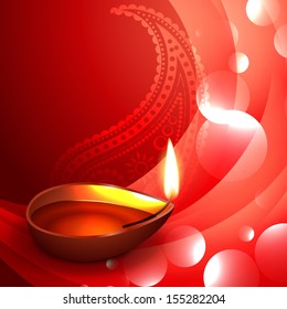 Stylish traditional Buddhist oil lamp on red wavy background