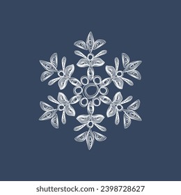 Stylish white quilling snowflake on a dark blue background. New Year's symbols. Paper technology of openwork weaving.