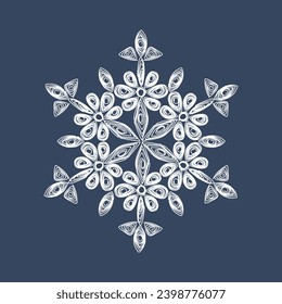 Stylish white quilling snowflake on a dark blue background. New Year's symbols. Paper technology of openwork weaving.