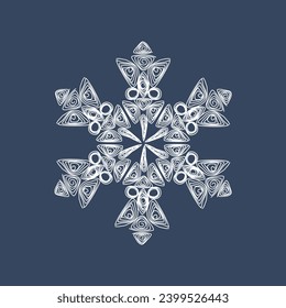 Stylish white quilling snowflake on a dark blue background. New Year's symbols. Paper technology of openwork weaving.