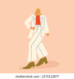 Stylish woman in white costume, modern fashion outlook. Fashion blogger walking and posing