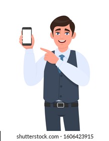 Stylish young businessman in vest suit showing blank mobile, cell phone and pointing finger. Trendy person holding smartphone screen. Digital technology, modern lifestyle concept in vector cartoon.
