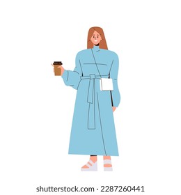 Stylish young woman student wearing fashion clothes standing with takeaway coffee cup in hand